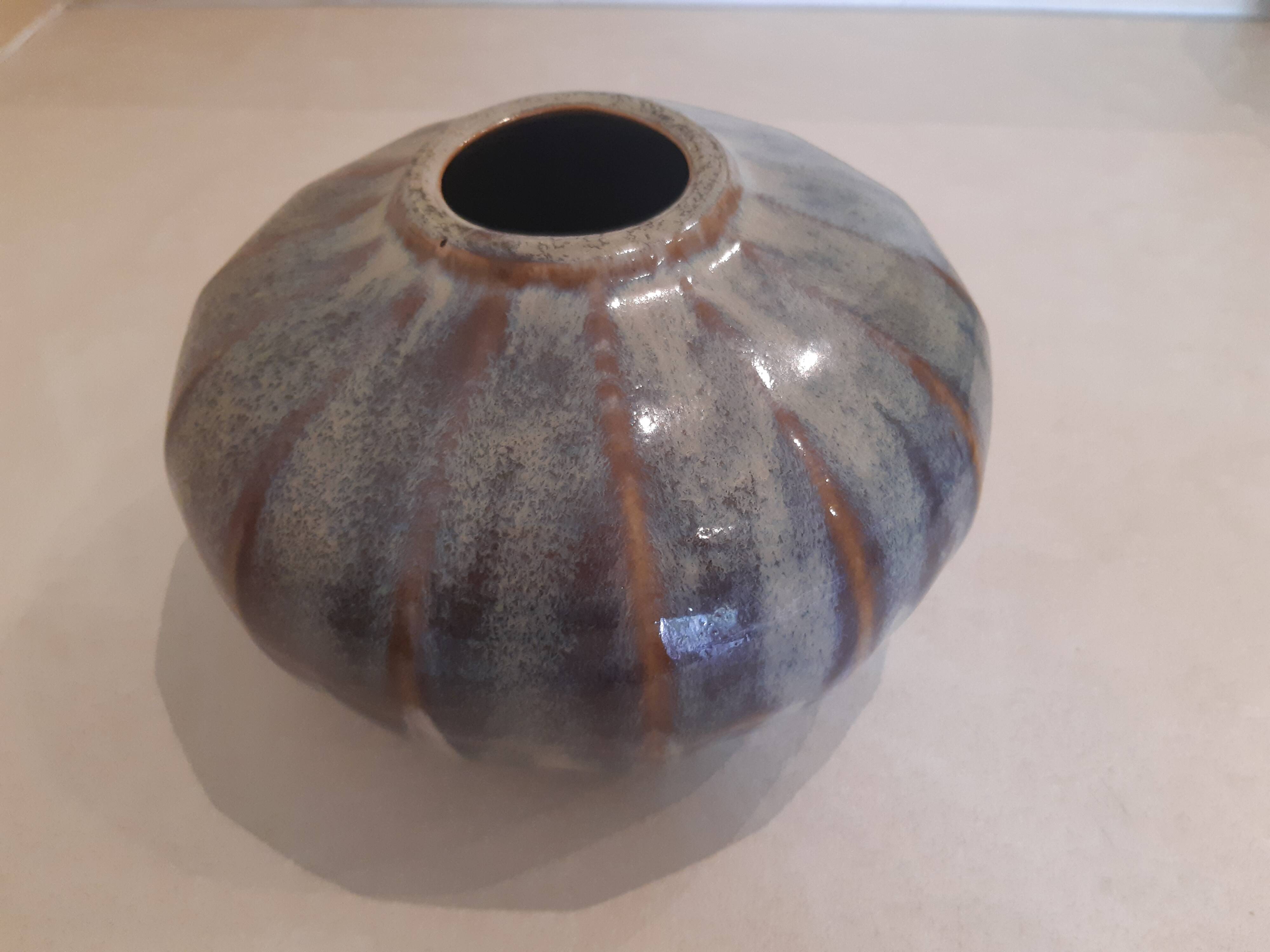 Globe vase, narrow neck, wide body.