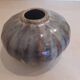 Globe vase, narrow neck, wide body.