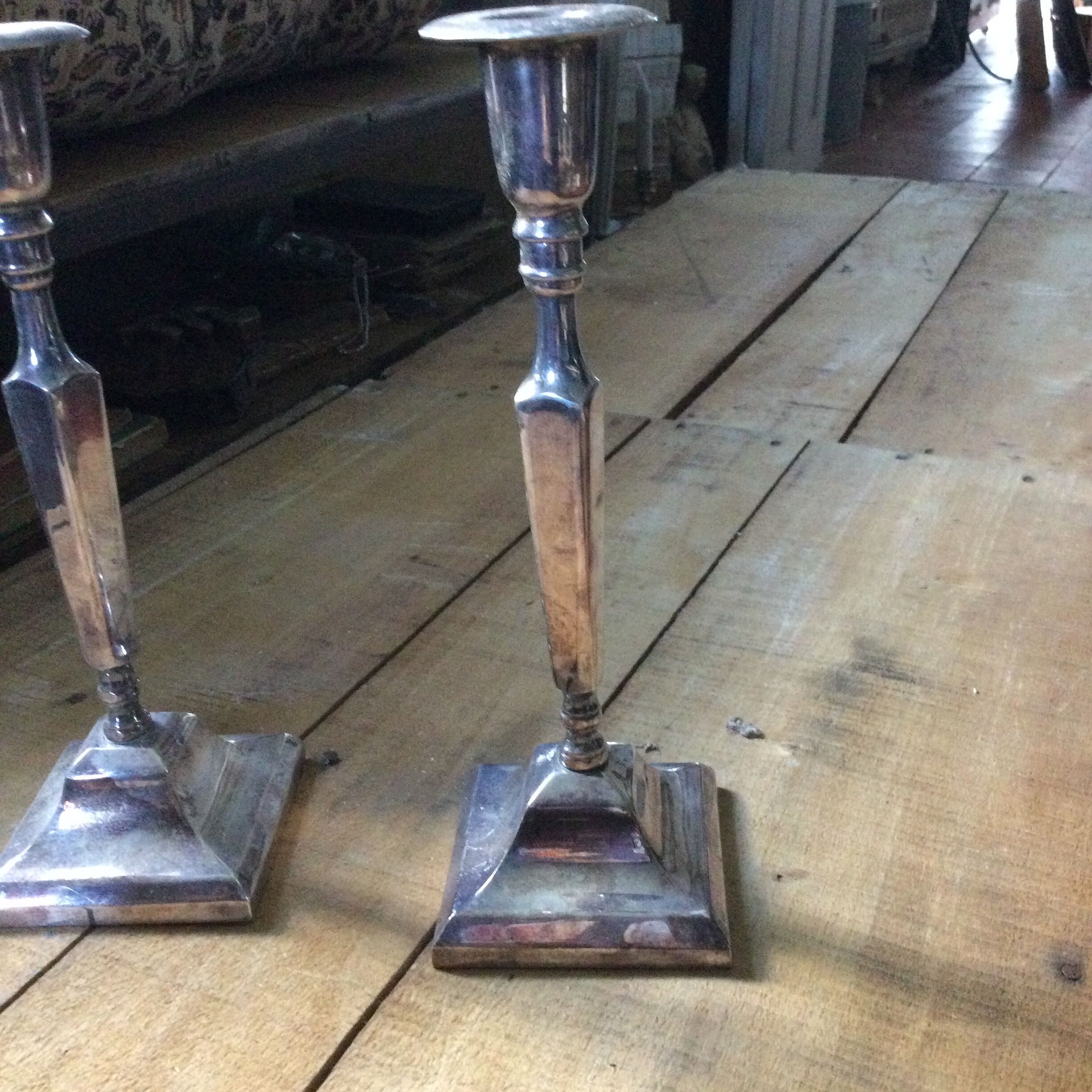 Pair of silver metal candle holders