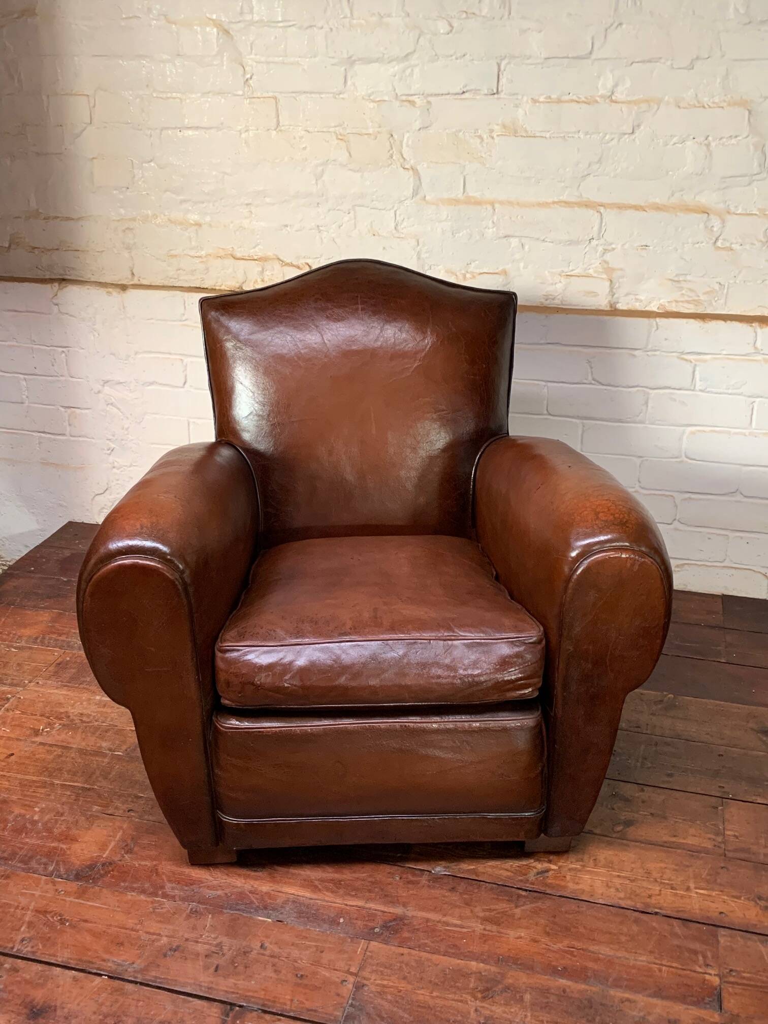 French leather club chair, chapeau de gendarme model circa 1950’s