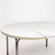Vintage round extendable dining table, white laminate on chrome legs.