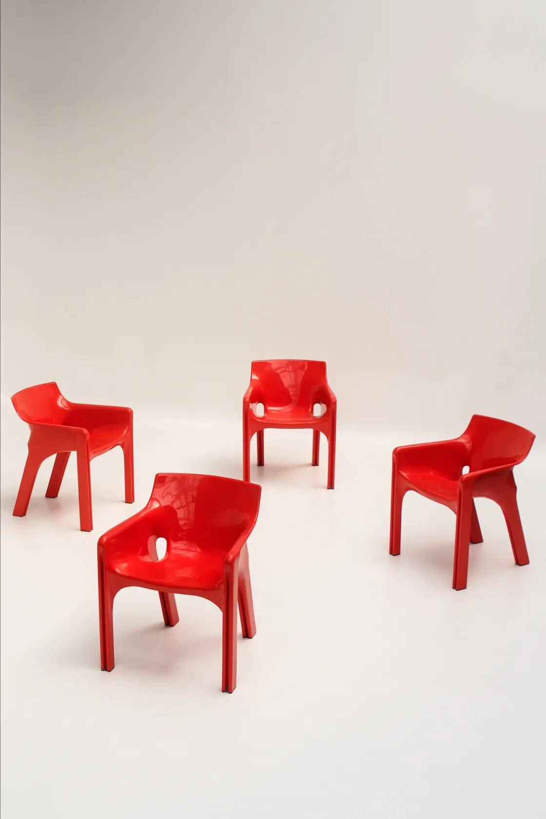 Set of 4 red "Gaudi" armchairs by Vico Magistretti for Artemide