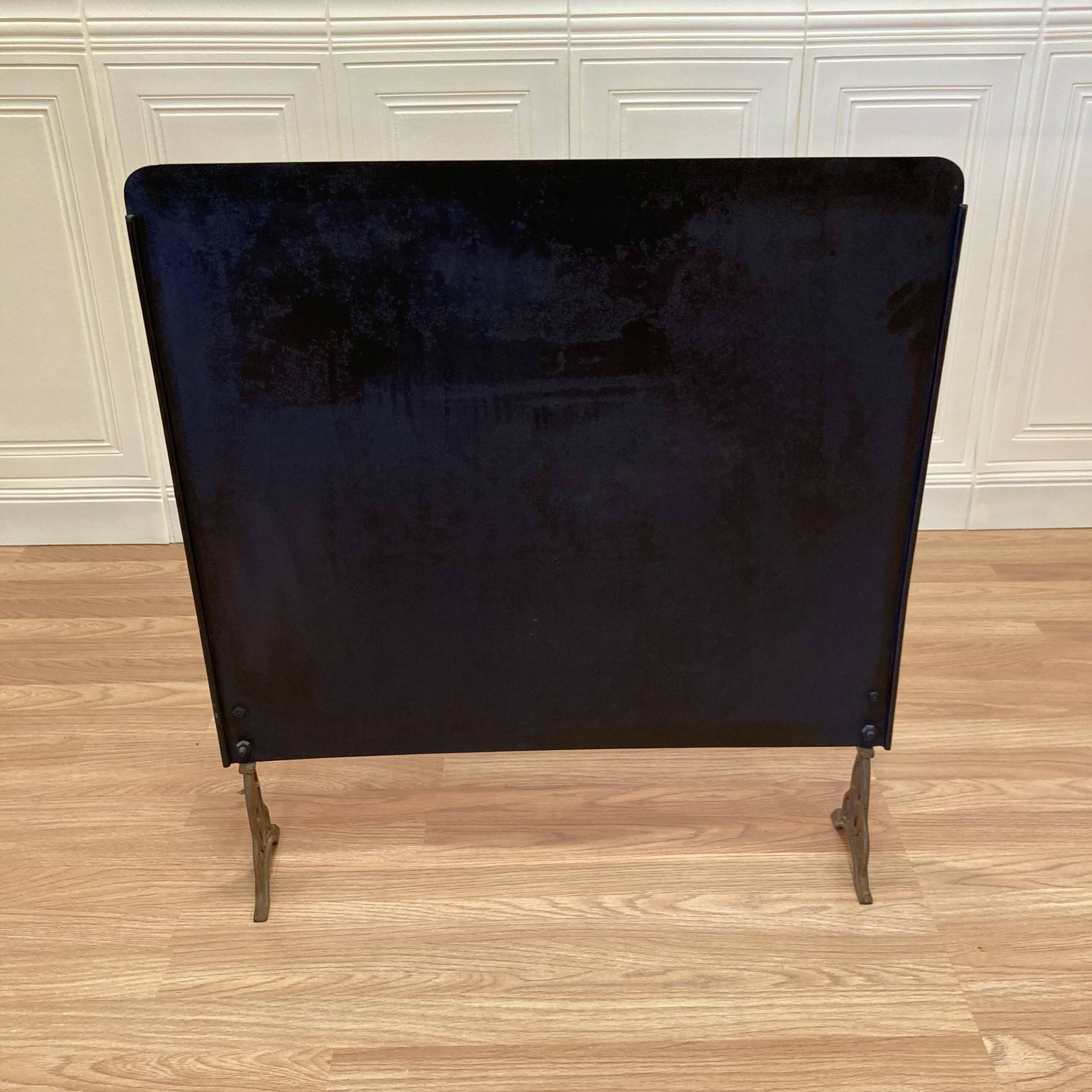 Antique metal fireplace screen.