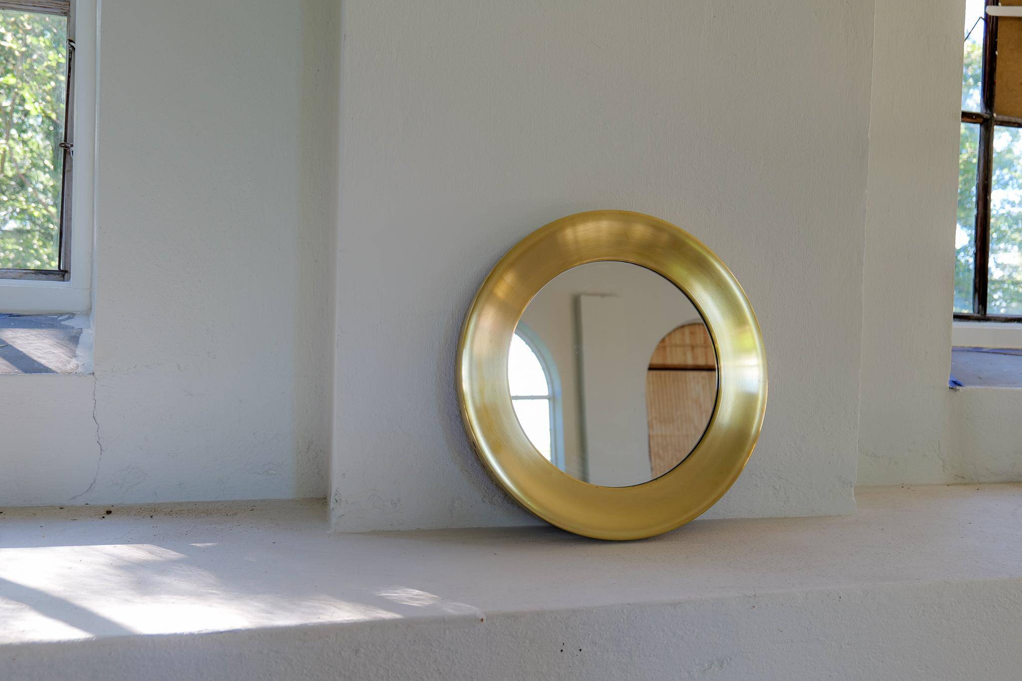 Modern round brass mirror from the mid-century by Glasmäster in Markaryd, Sweden, 1960s.