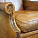 Positively lived-in sheepskin leather wing chair with pleasant seating comfort