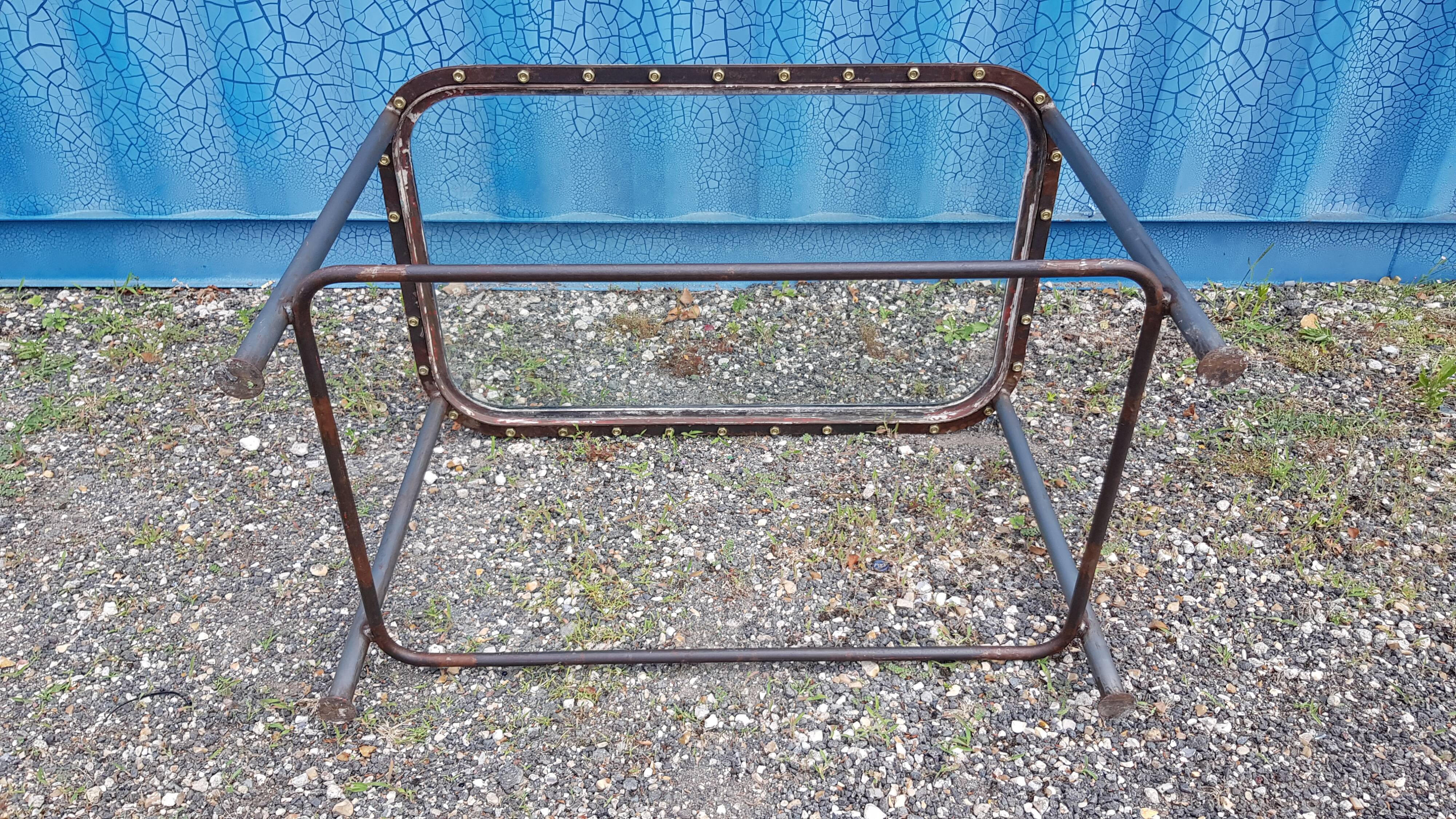 Table with an old ship porthole in brass and a metal base / 110 x 70 x 76 cm