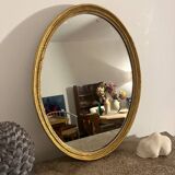 Old golden oval mirror