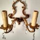 Rococo-style wall lamp in gilded bronze and crystal stamps