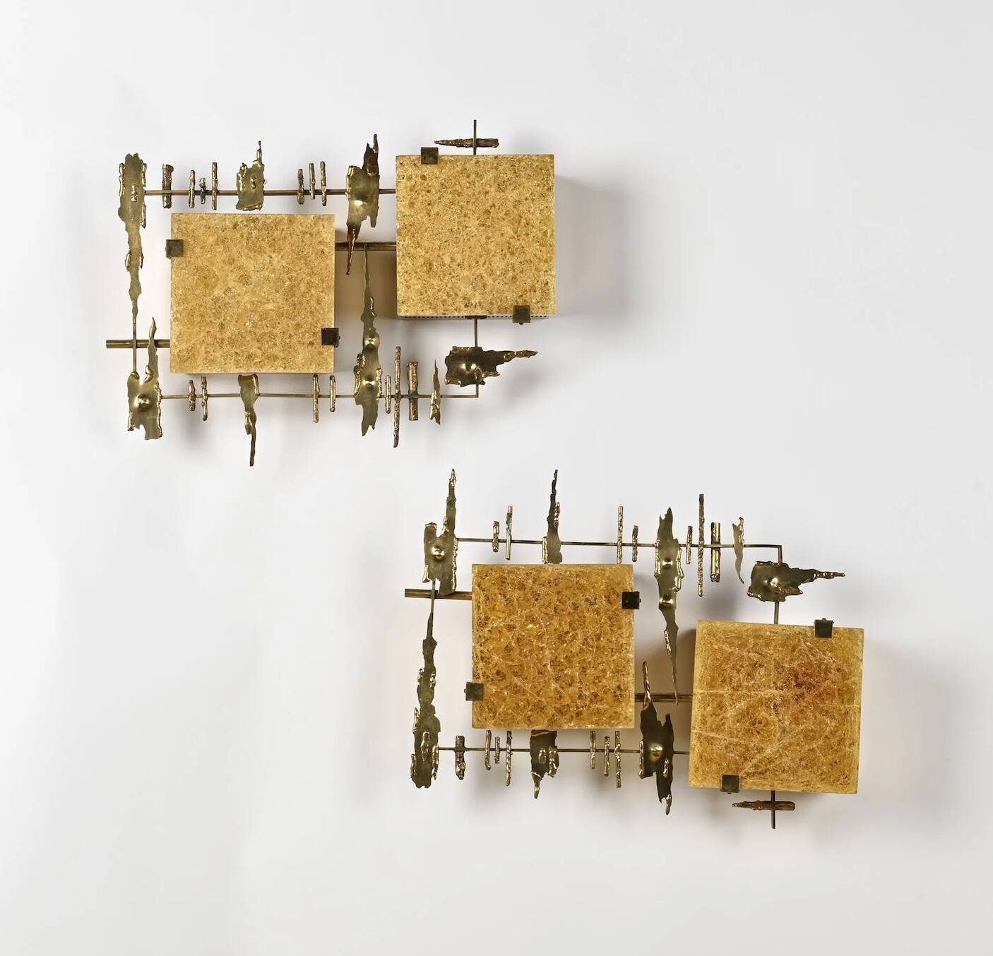 Pair of brutalist wall sconces in brass and fractal resin from the 1970s.