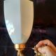 Golden brass wall light with glass tulip - dolphin pattern bathroom lamp