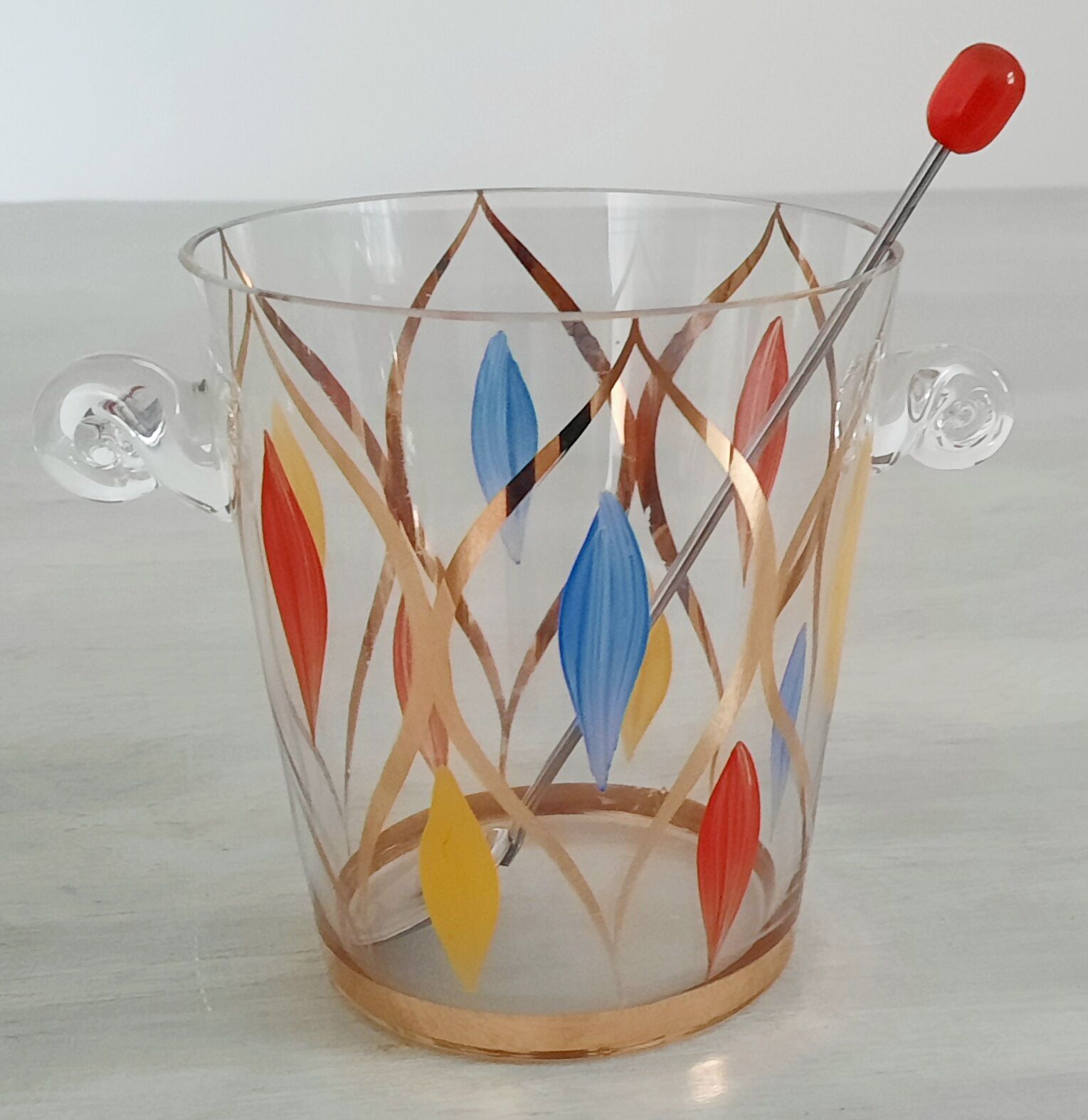 Glass ice bucket, metal spoon and vintage bakelite