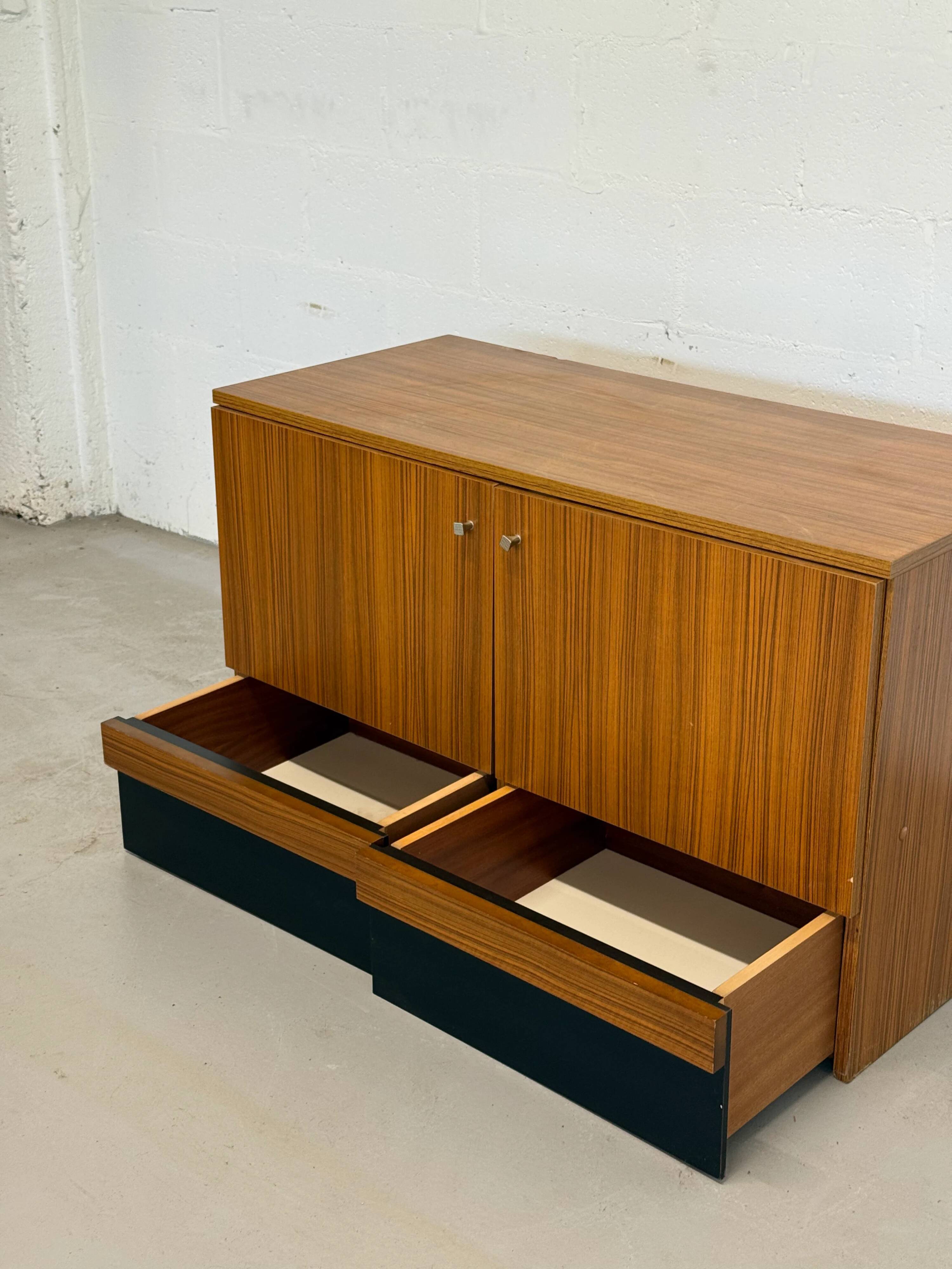 Vintage teak sideboard, mid-century style, with doors and drawers.