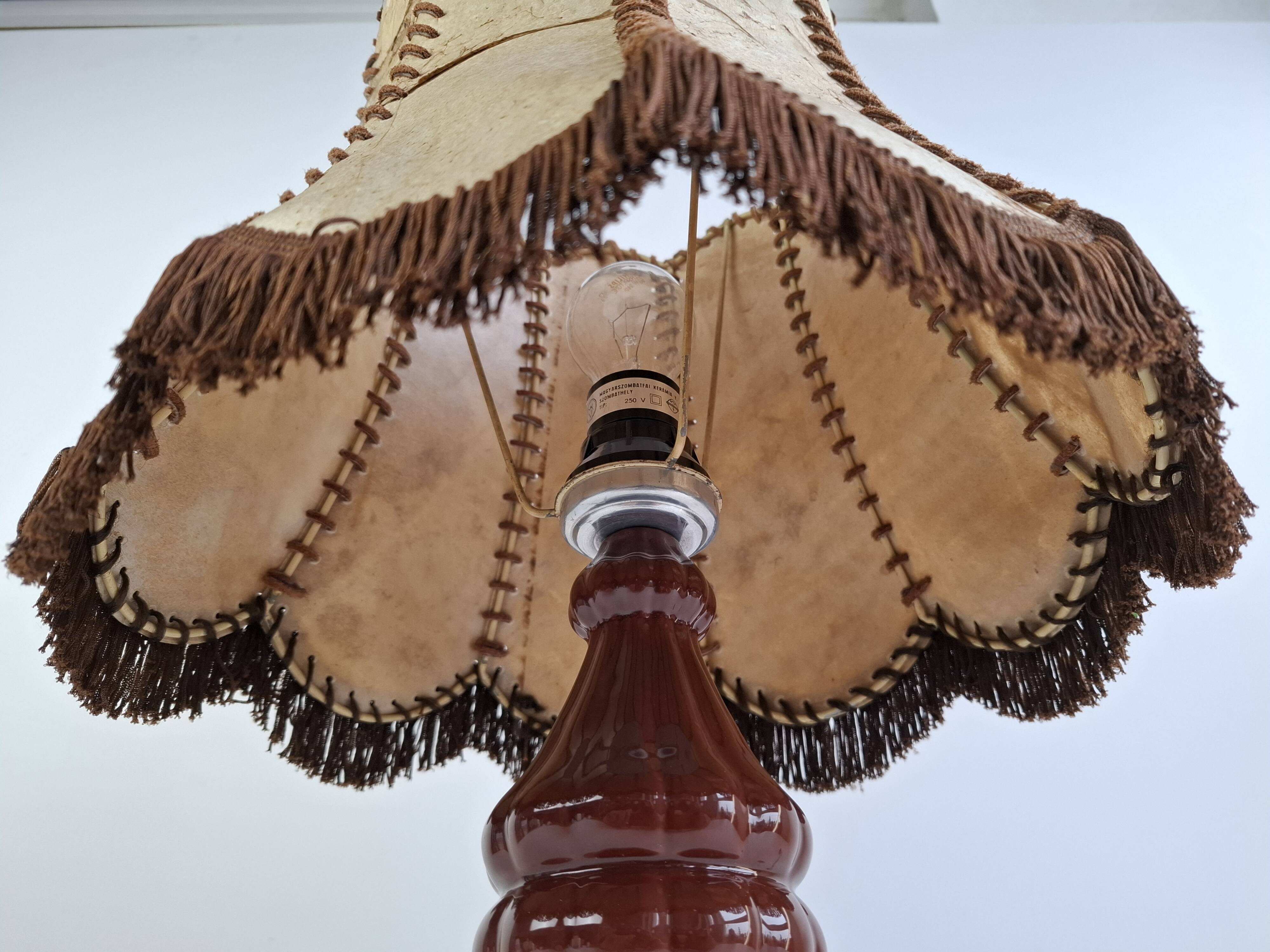 Vintage ceramic table lamp with hand-stitched leather shade, 1980s.