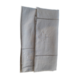 Old white linen tablecloth and stylized monogram embroidery days and plumetis