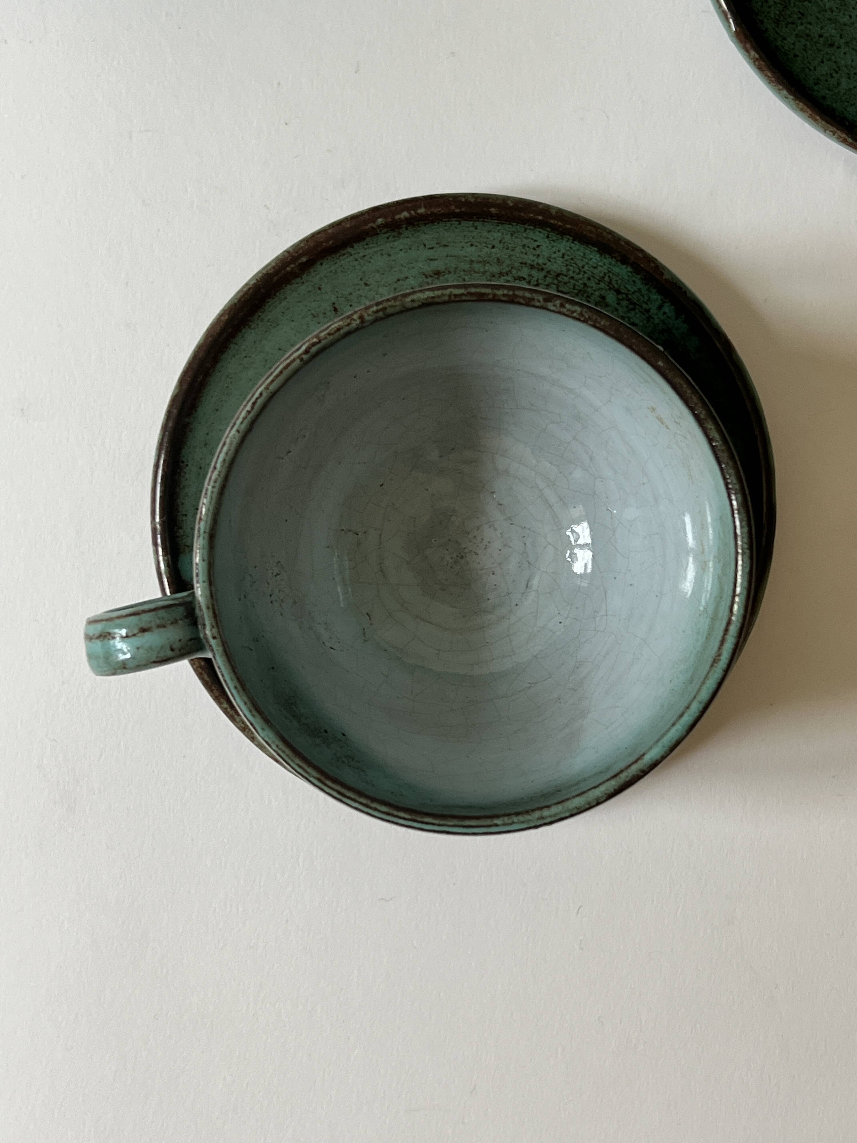 Handmade and signed glazed ceramic coffee cups, circa 1950.