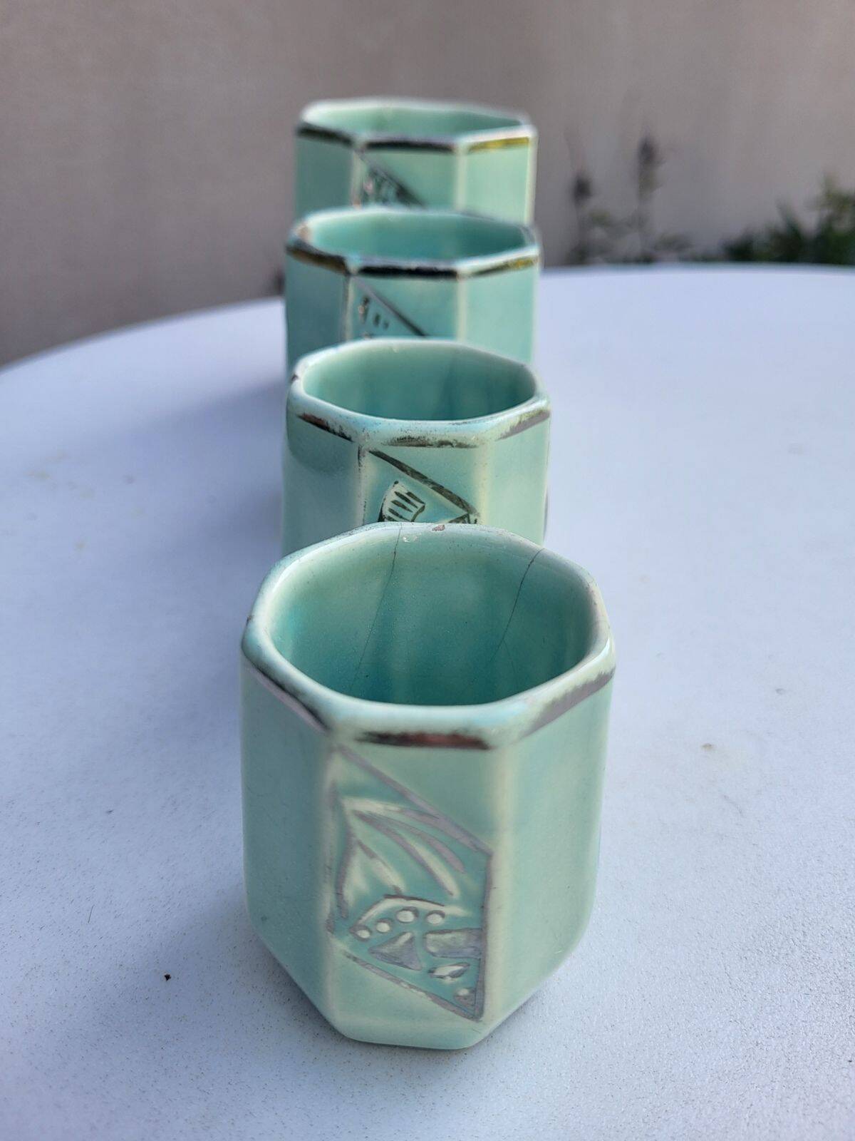 Set of 4 Art Deco celadon green and silver barbotine pots.