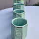 Set of 4 Art Deco celadon green and silver barbotine pots.