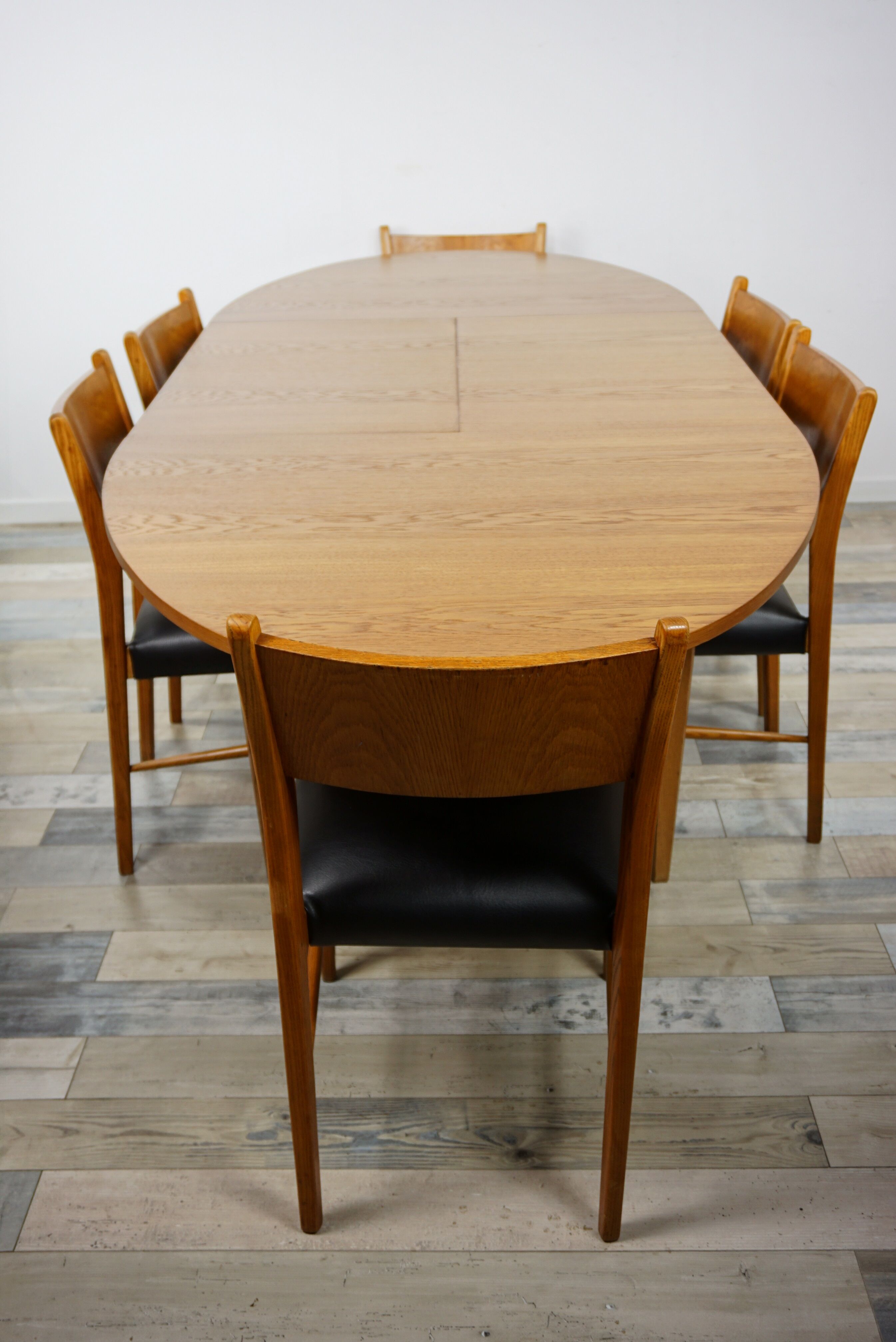 Wooden oval table and 6 matching chairs 60