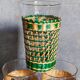 Four long drink glasses in vintage woven rattan cases