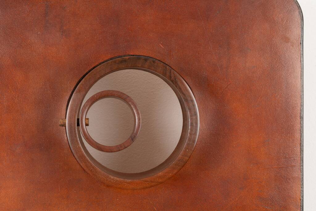 Stools and wall lights in cherry wood and leather. 1970s.