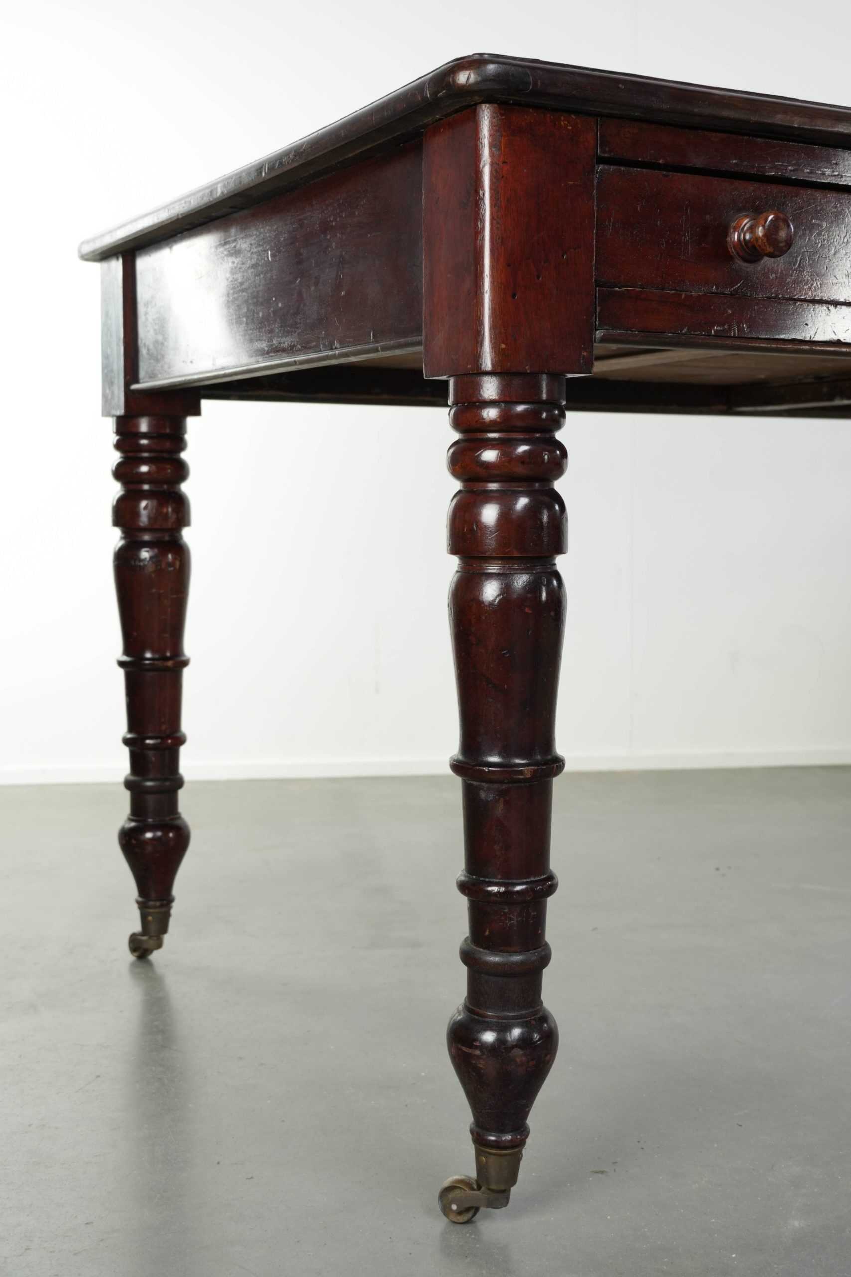 Antique English writing desk from the late 19th century with a warm colour