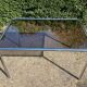70s dining table in tubular chrome metal and smoked glass