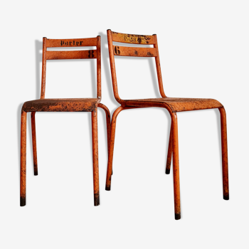 Pair of patinated orange metal chairs