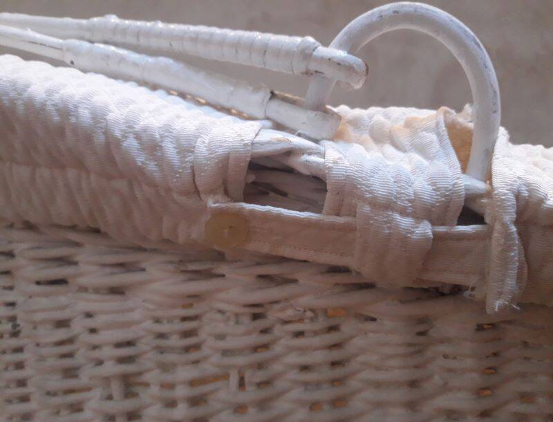 Wicker and painted wood baby cradle