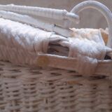 Wicker and painted wood baby cradle
