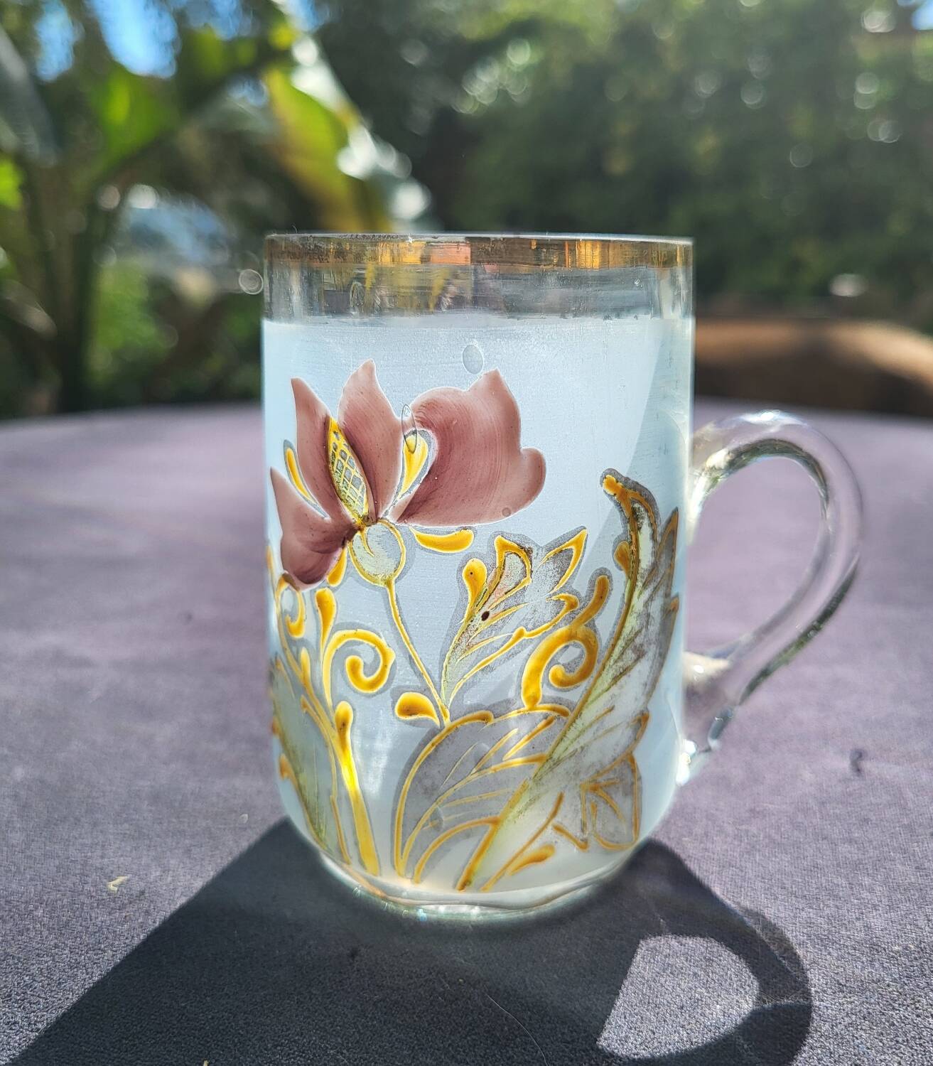Old enameled blown glass cup