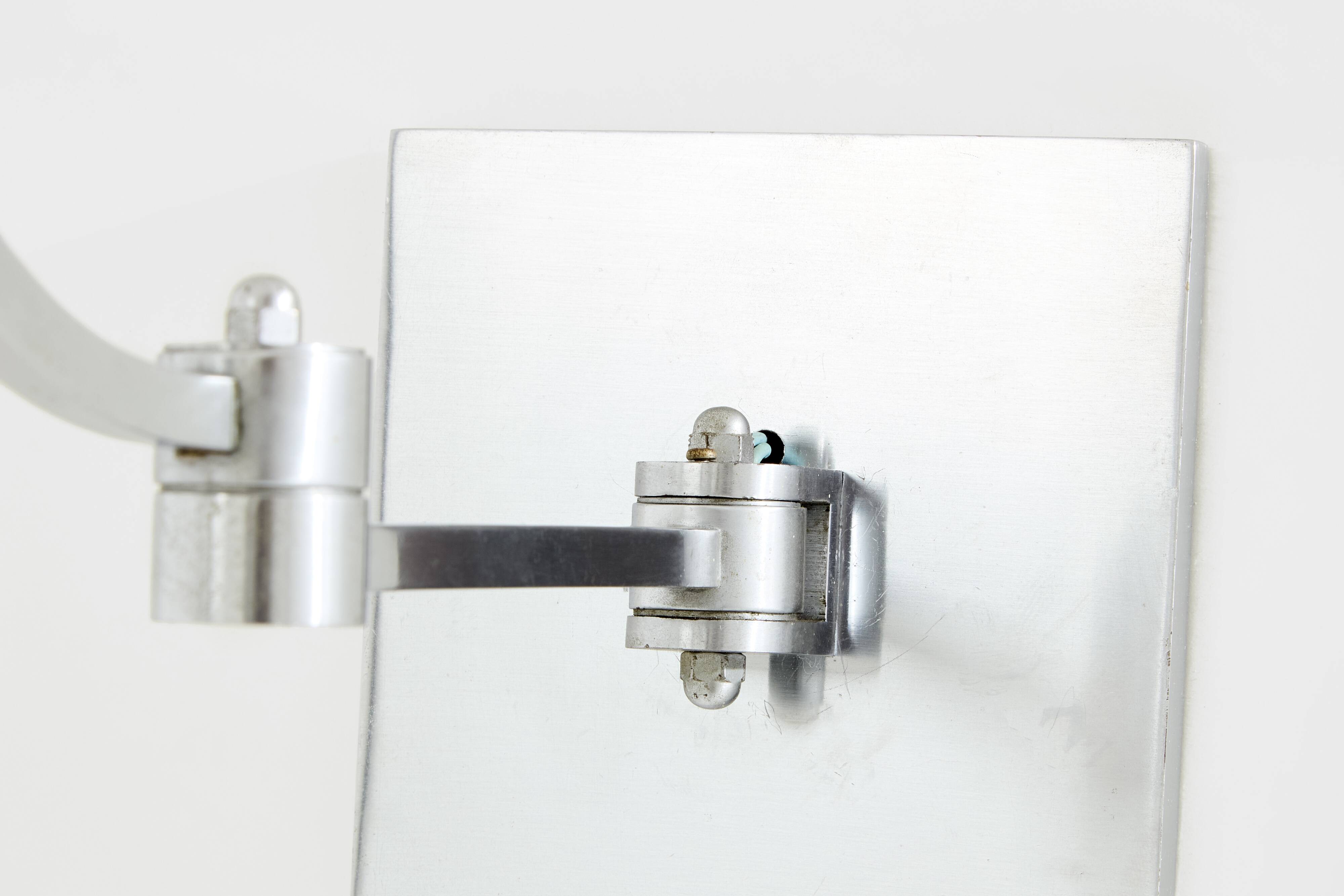 Maison Charles adjustable wall light, brushed steel, circa 1960