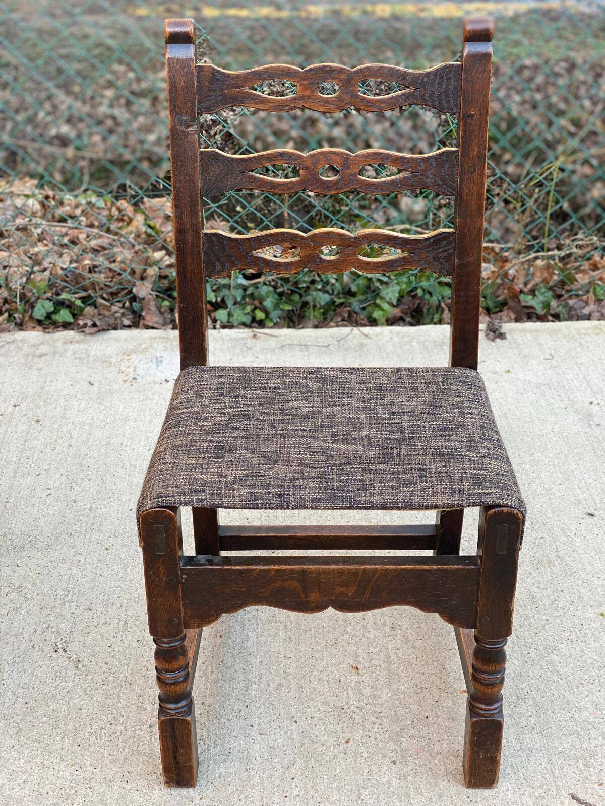 6 solid wood dining chairs with grey woven wool seats.