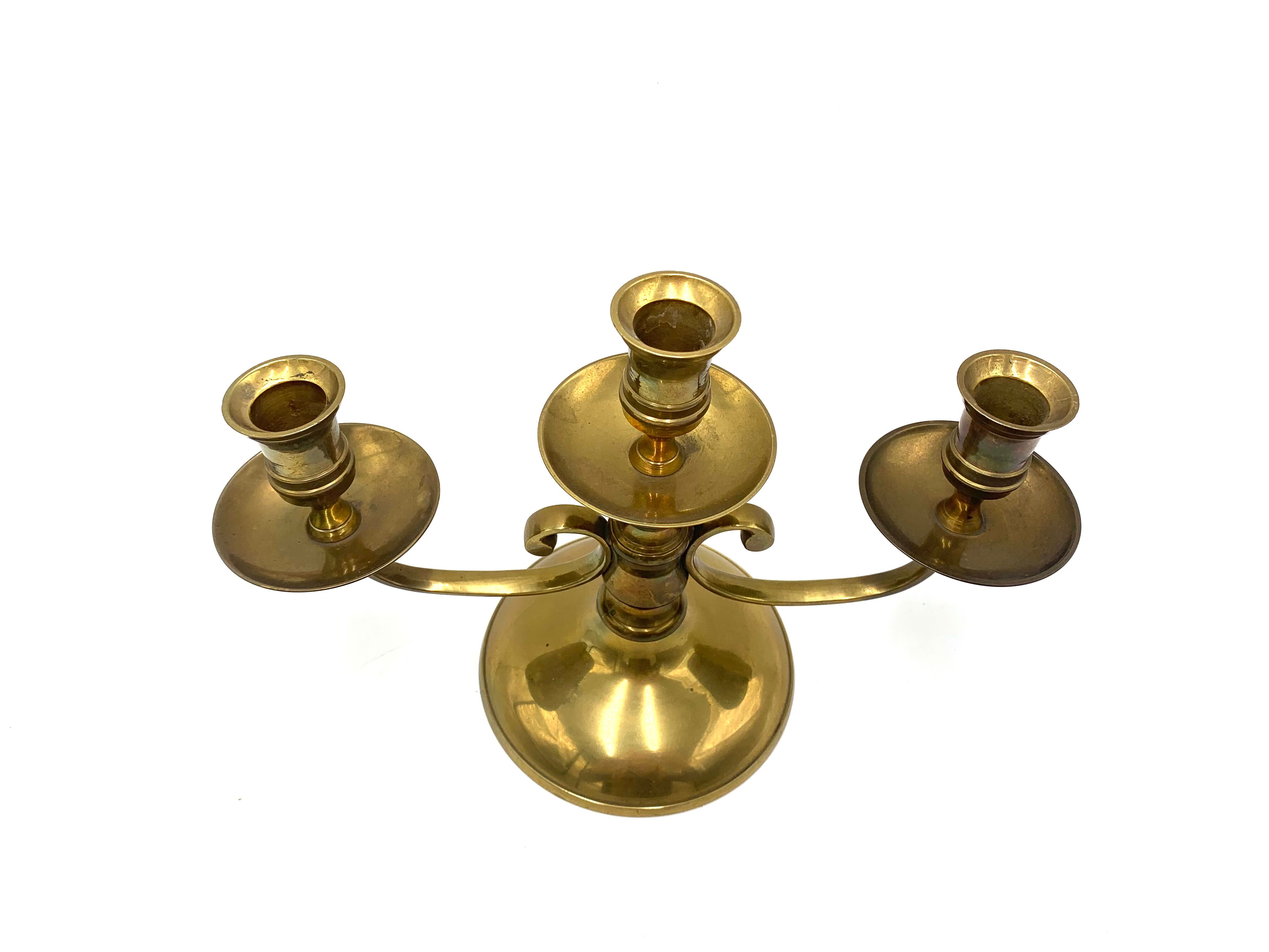 Brass three-arm candlestick