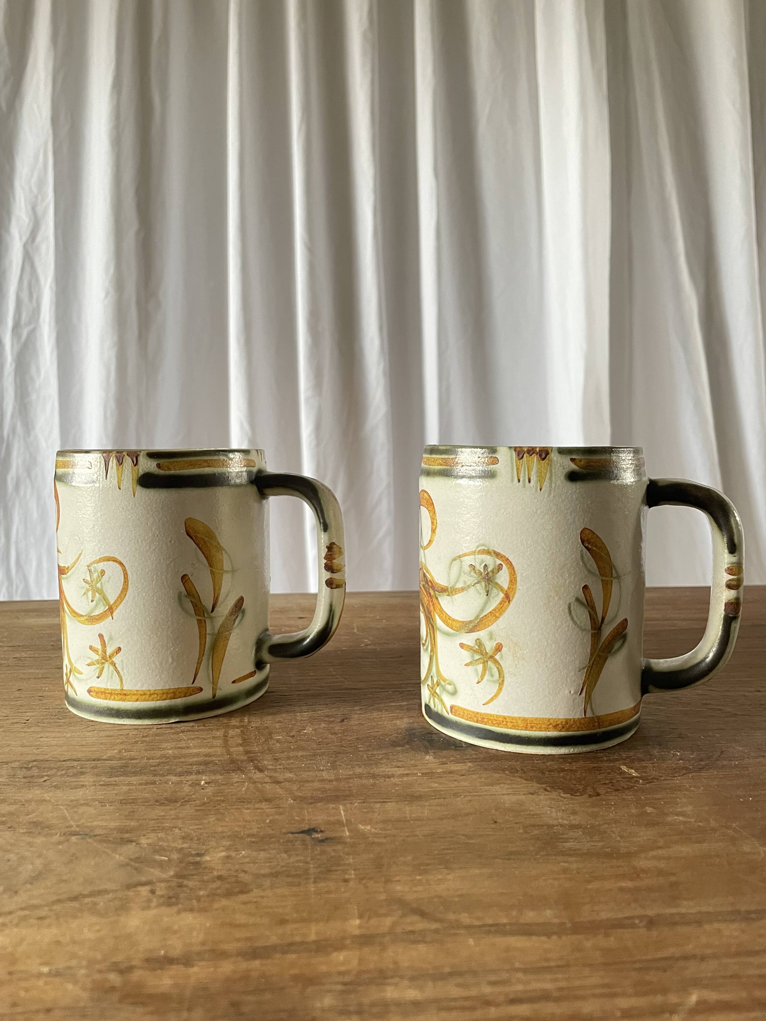 Pair of stoneware beer mugs signed Keraluc, Quimper 1950