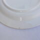 Set of 4 white and blue dinner plates.