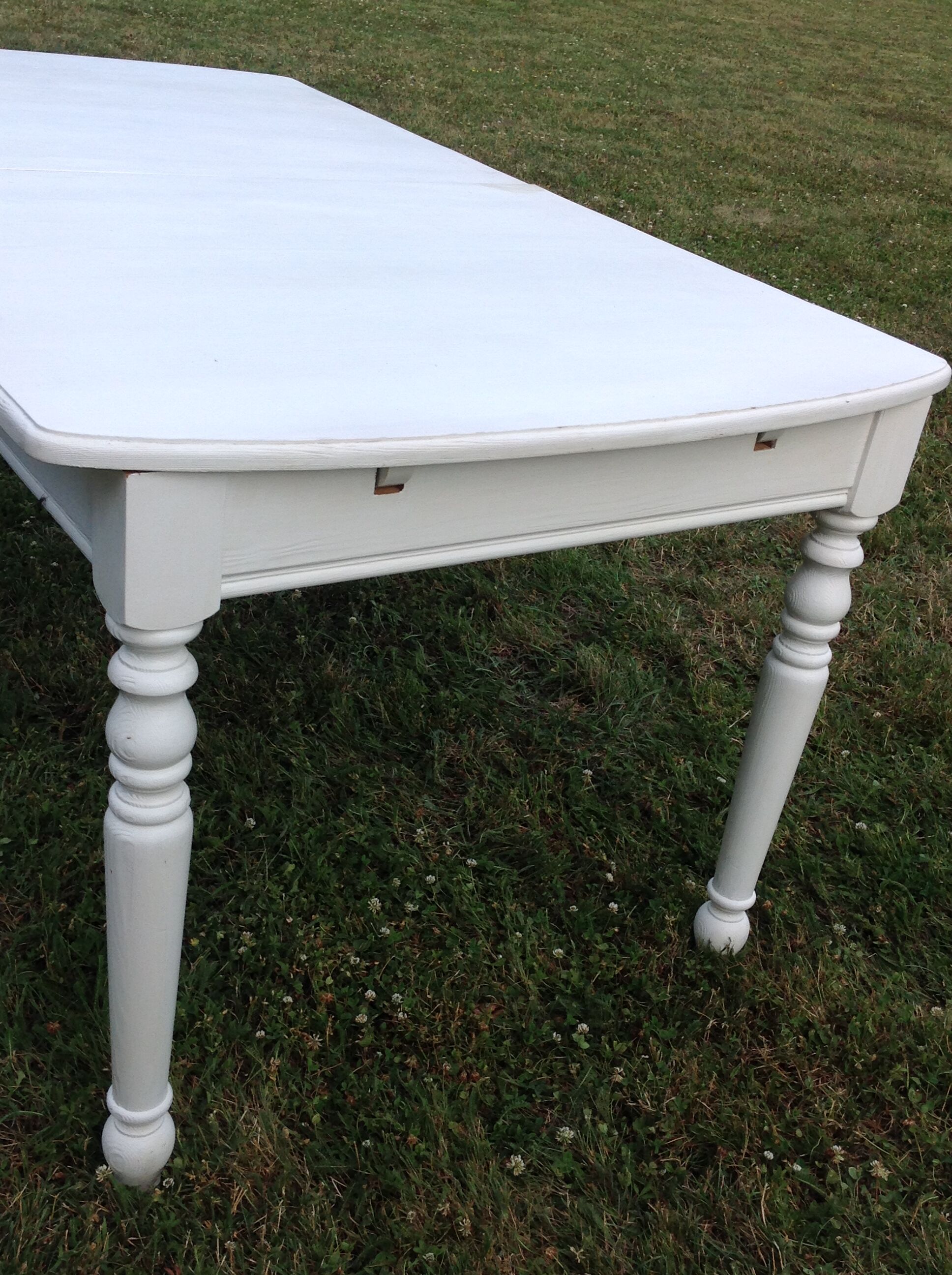 White farmhouse table set and four chairs