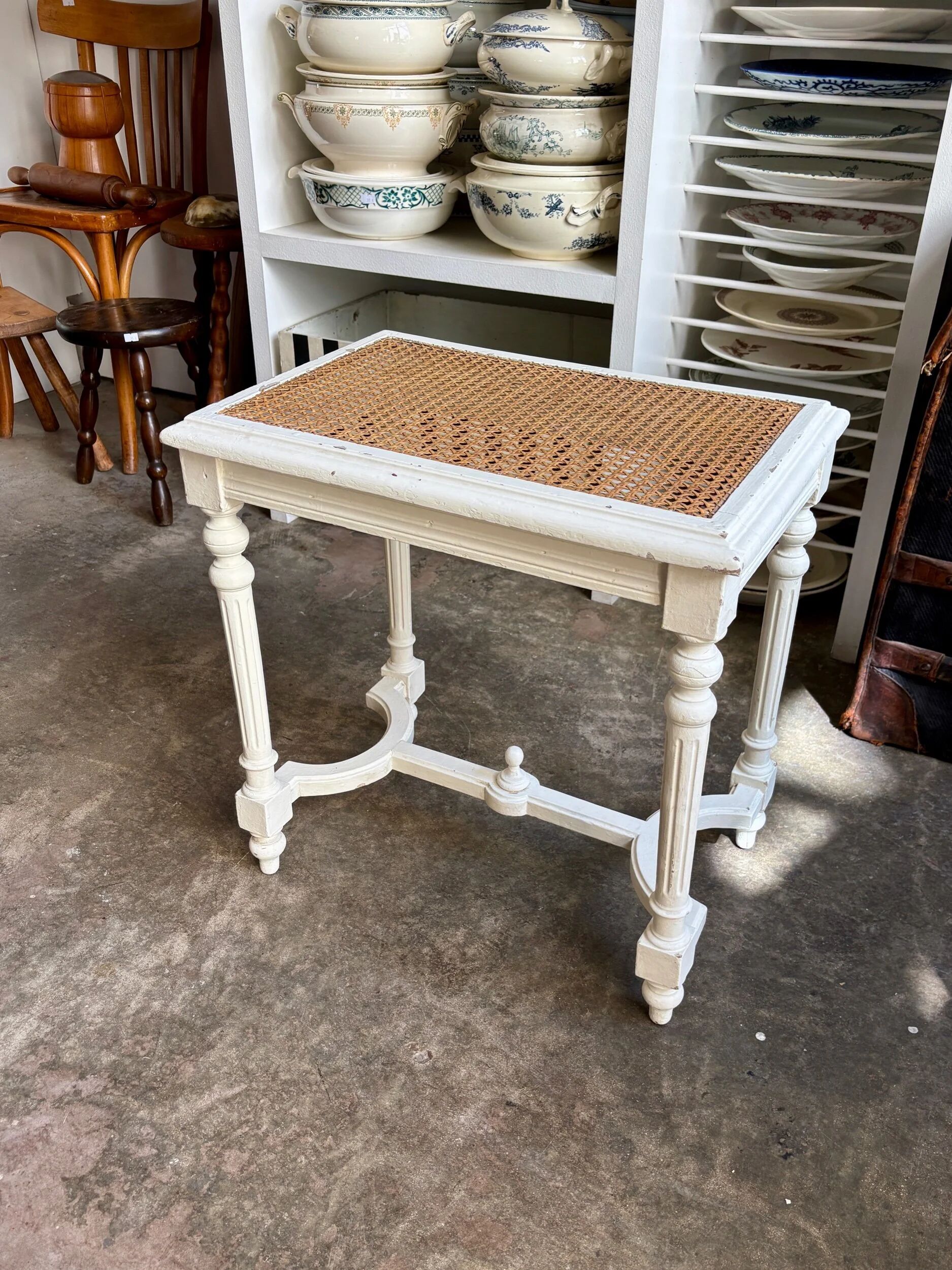 Stool, small wooden piano bench in white with caning.