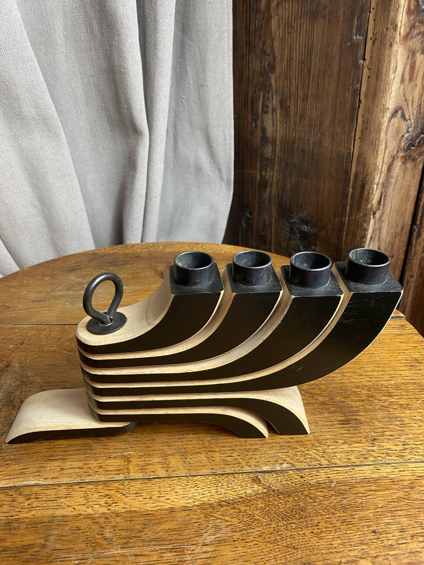 Foldable and deconstructed chandelier, minimalist Swedish design in wood.