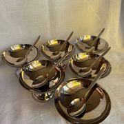 Set of 6 stainless steel ice cream bowls by Guy Degrenne with matching spoons.