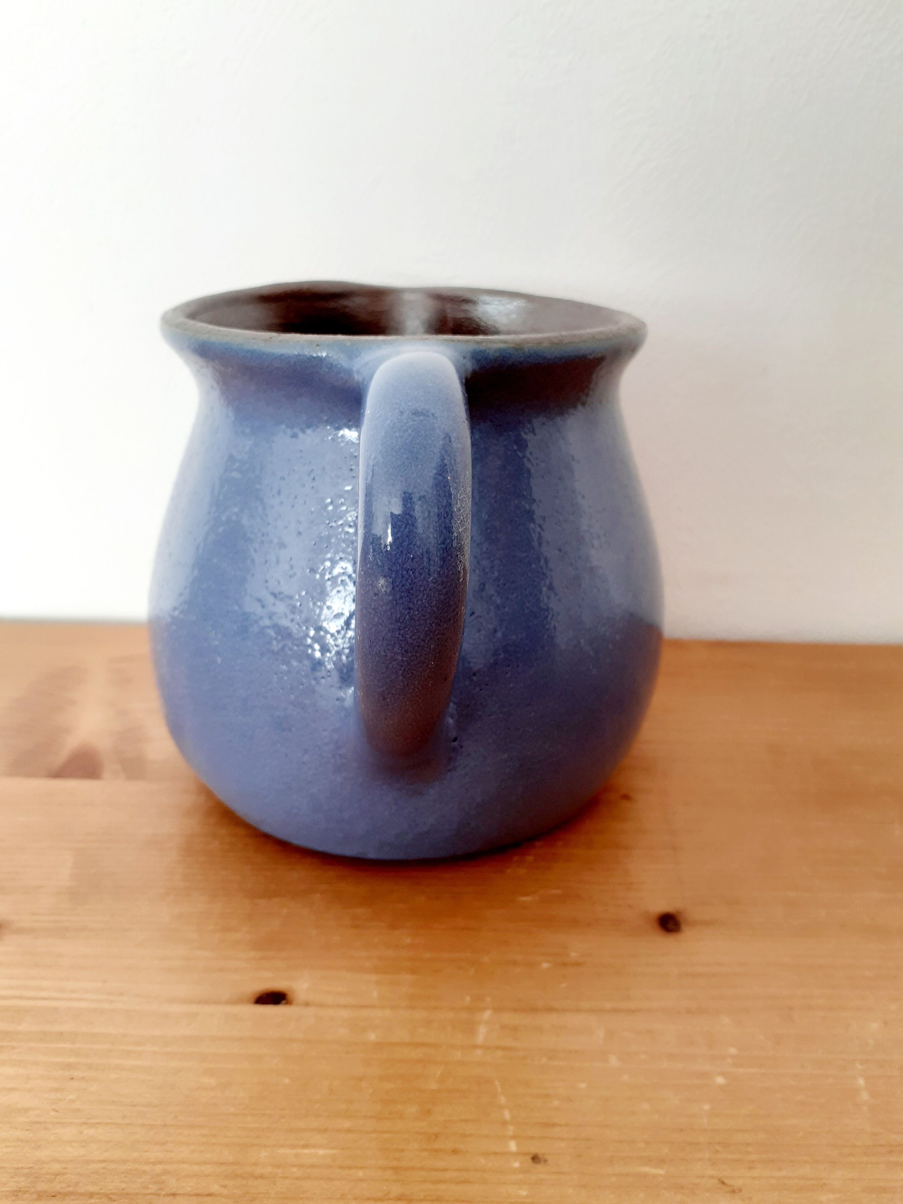 Old glazed blue sandstone pitcher