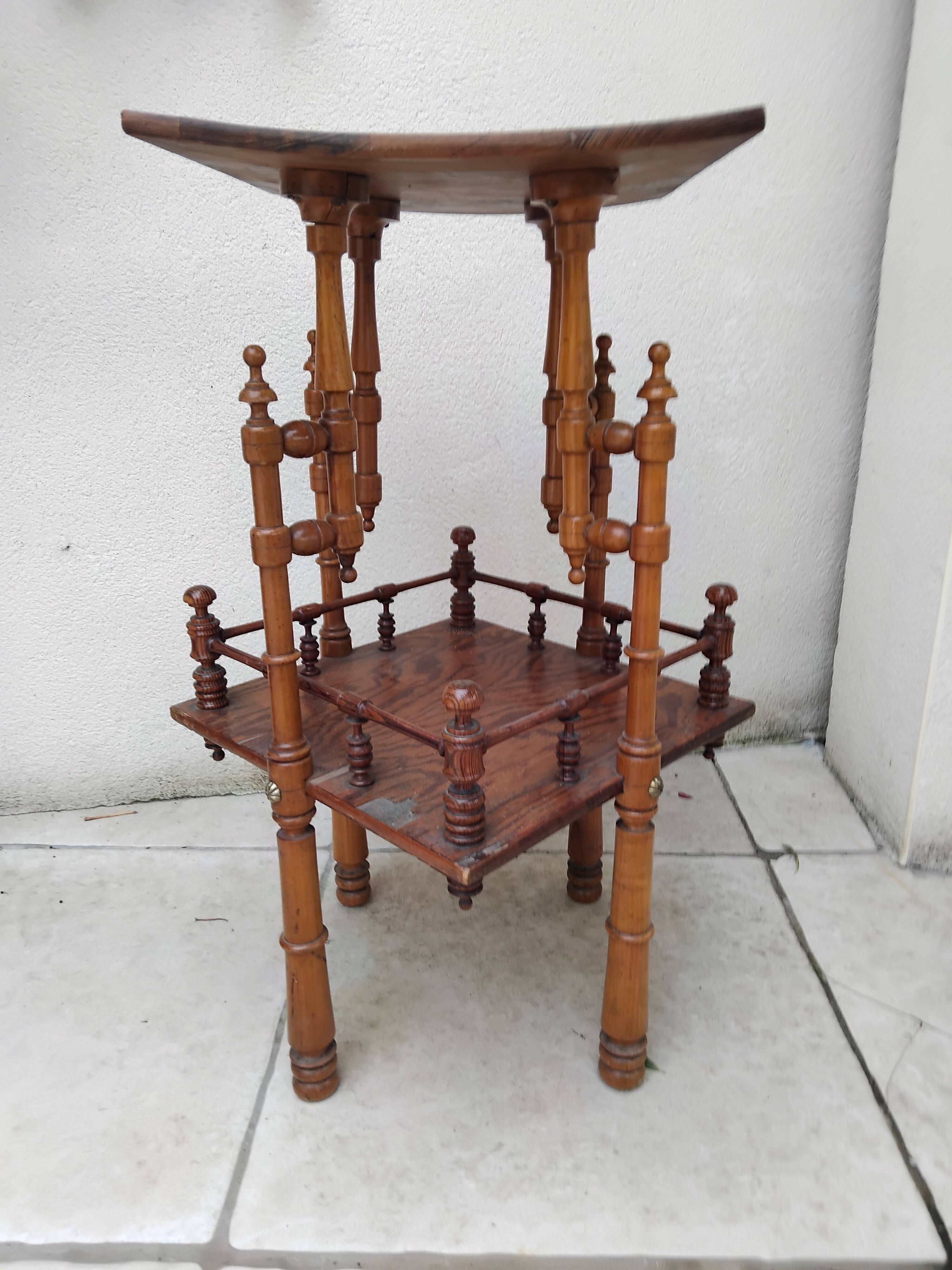 Antique pedestal table in Asian Japonese style.