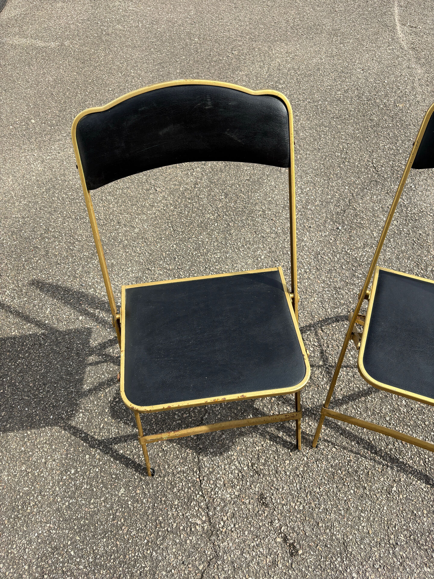 Two chairs, similar black