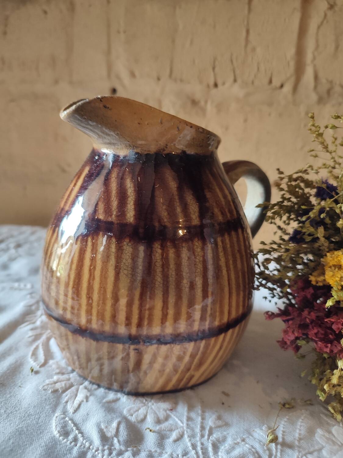 Old sandstone pitcher vase