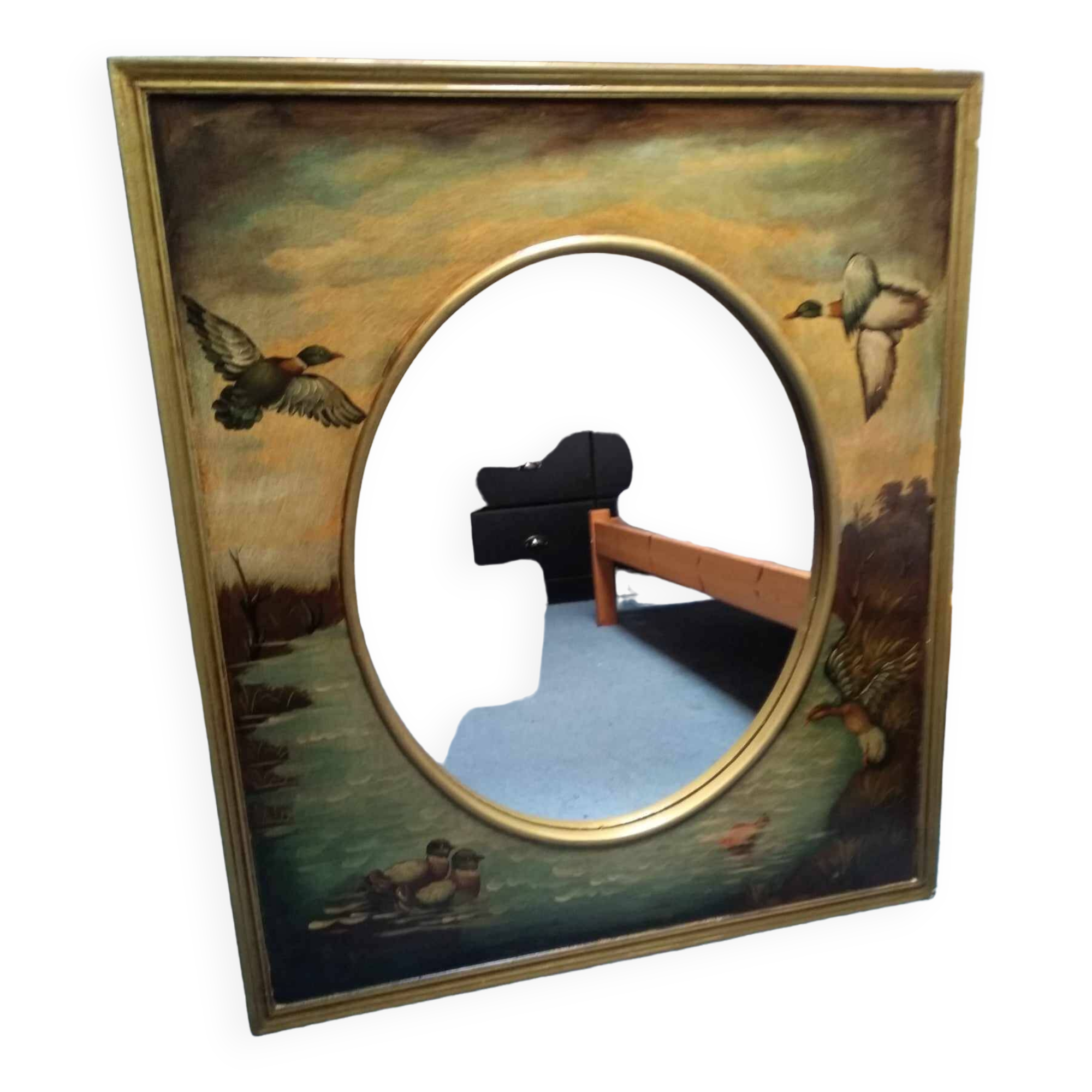 Oval mirror in duck pattern frame