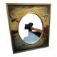 Oval mirror in duck pattern frame