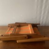 Old foldable beach seat in wood and canvas for children