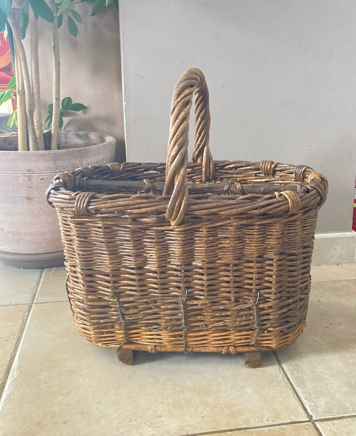 Wicker and hazel bottle basket from the early 20th century or possibly earlier.