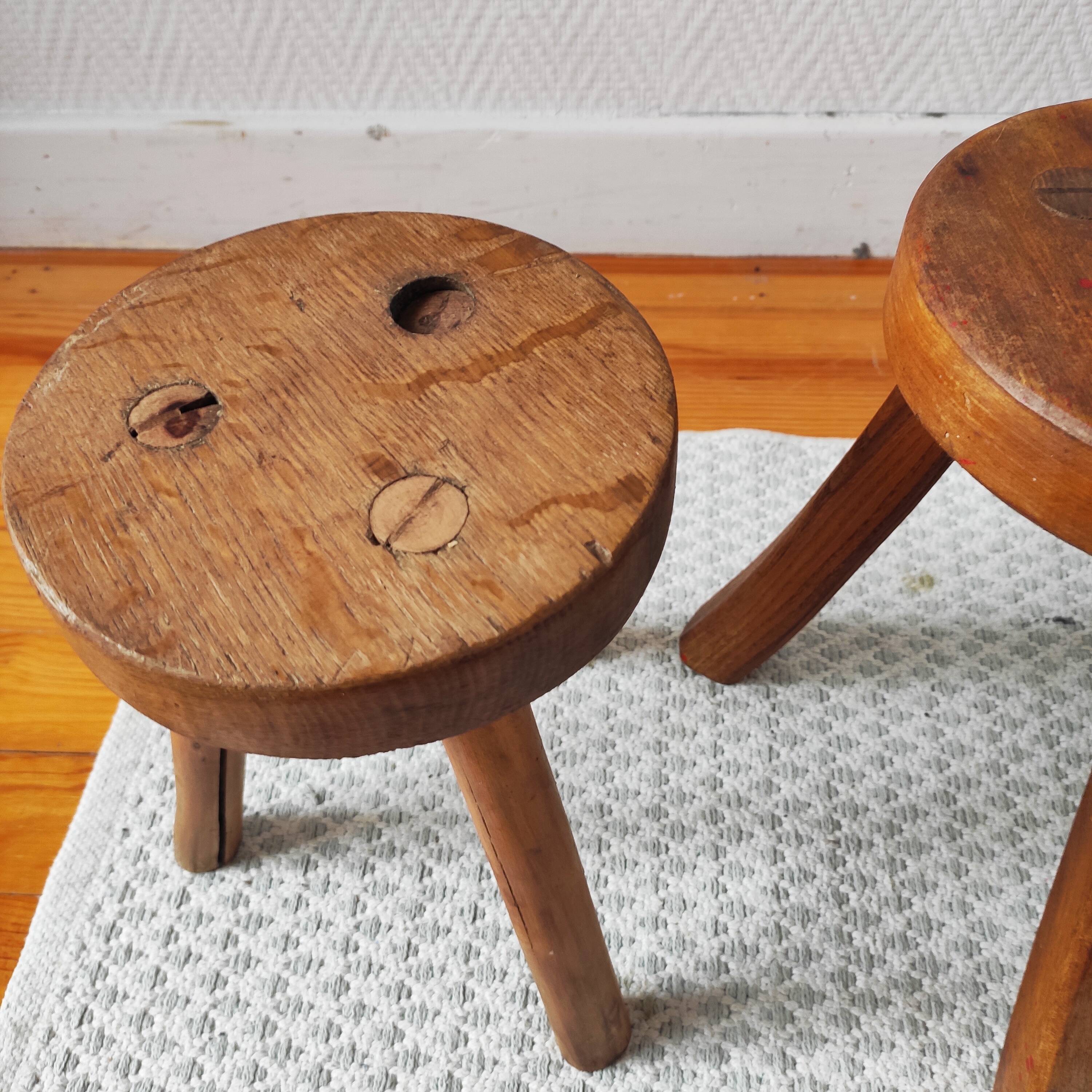 3 wooden tripod stools