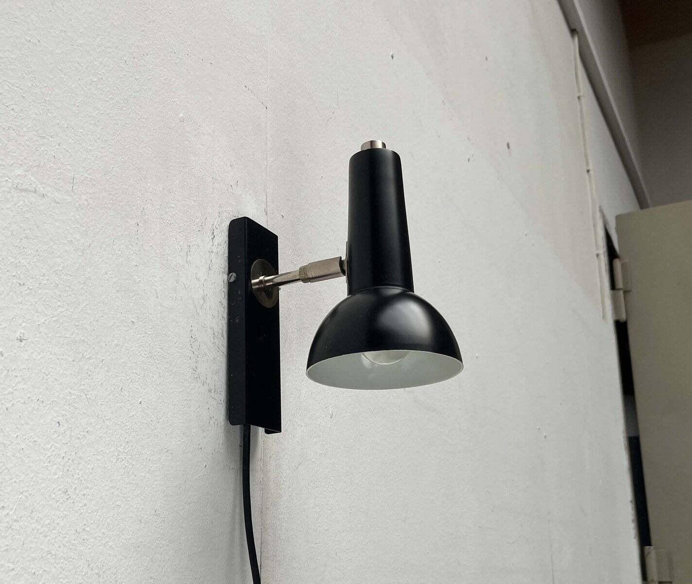 Mid-century German black minimalist wall lamp by Hustadt, 1960s.