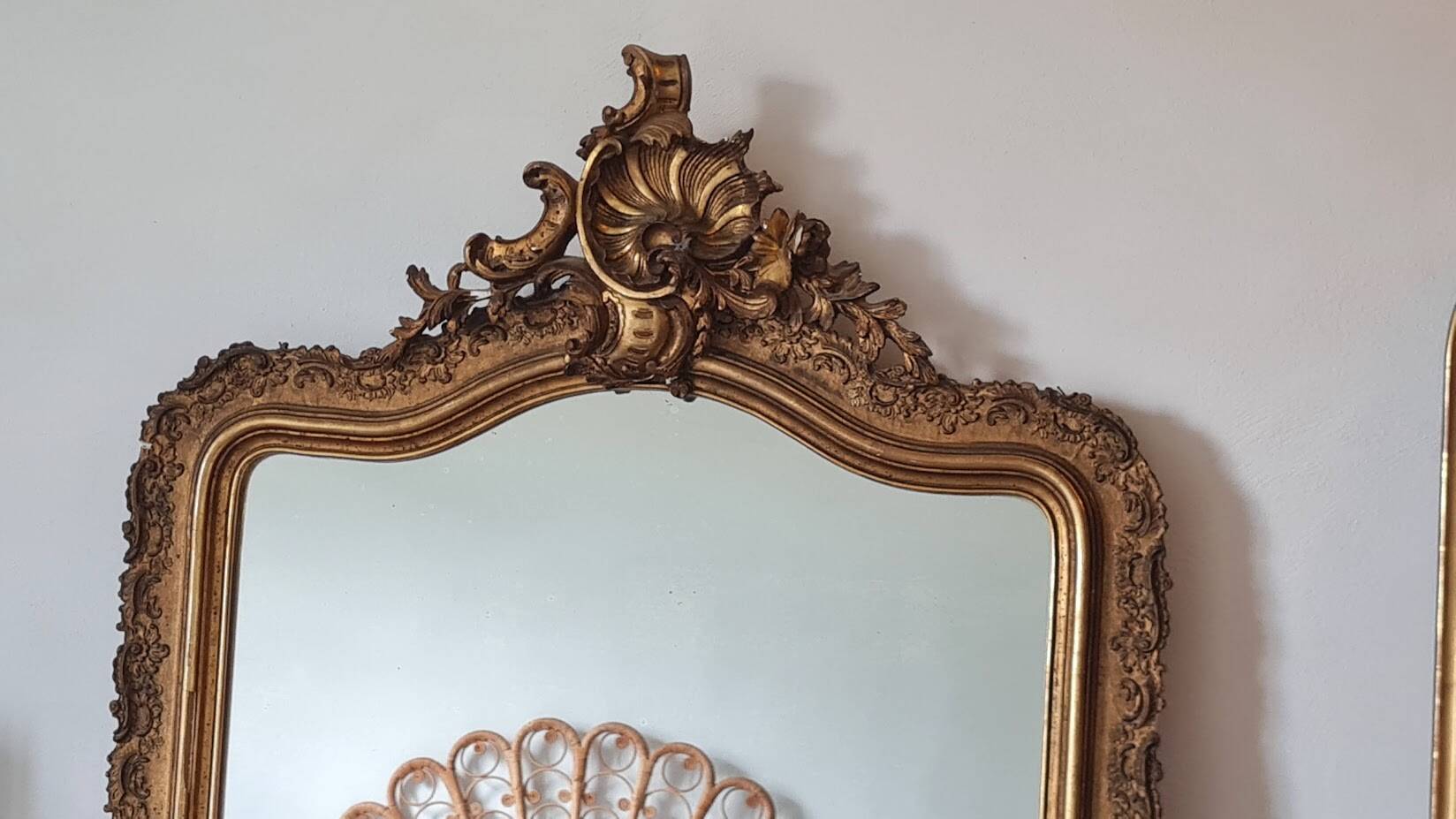 Antique Louis Philippe mirror with a pediment.